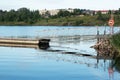 Summer village landscape. Wooden pier on the river and a lifebuoy. Royalty Free Stock Photo