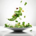 Summer vitamin salad of green lettuce leaves and various vegetables flying in the air on a white background Royalty Free Stock Photo