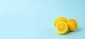 Summer and vitamins background banner. Lemon on a blue background, minimal food concept