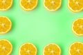 Summer and vitamins background frame. Lemon on a green background, minimal food concept