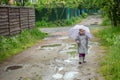 Summer walk in the rain little girl with an umbrella Royalty Free Stock Photo