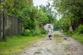 Summer walk in the rain little girl with an umbrella Royalty Free Stock Photo