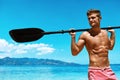 Summer Water Sport. Man With Canoe Kayak Paddle On Beach