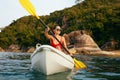 Summer Water Sport. Woman Traveling In Kayak Near Green Island Royalty Free Stock Photo
