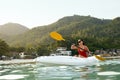 Summer Water Sport. Woman Traveling In Kayak Near Green Island Royalty Free Stock Photo