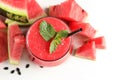 Summer watermelon drink in glass and sliced fresh fruit on table Royalty Free Stock Photo