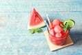 Summer watermelon drink in glass, sliced fruit