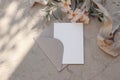 Summer wedding stationery.still life. Greeting card, invitation mock up, craft envelope. Apricot oleander flowers, olive