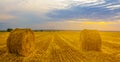 summer wheat field with haystack at the sunset Royalty Free Stock Photo