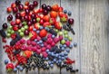 Summer wild berry fruits on vintage board still life Royalty Free Stock Photo