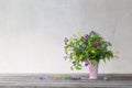 the summer wild flowers in pink ceramic vase on white background Royalty Free Stock Photo