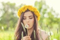 Summer woman blowing on dandelion flowers Royalty Free Stock Photo