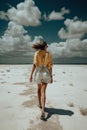 Summer woman in hat walking away in white sand , blue sky. Ai generative