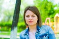 Summer woman portrait. Girl on a background of blurry children`s slides