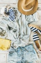 Summer woman`s outfit flatlay, top view, vertical composition