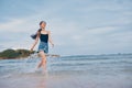 summer woman sea beach smile running lifestyle sunset activity travel young Royalty Free Stock Photo