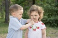 In the summer in the woods two little soiled in the mud baby boy Royalty Free Stock Photo