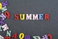 Summer word on black board background composed from colorful abc alphabet block wooden letters, copy space for ad text. Learning Royalty Free Stock Photo