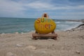 Summer word carved and colored on a yellow stone front of the sea Royalty Free Stock Photo