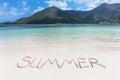 The Summer word written on the beach sand. Royalty Free Stock Photo