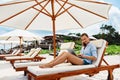 Summer Work. Woman Relaxing Using Computer On Beach. Freelance Business Royalty Free Stock Photo