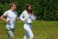 Summer - Young couple running in meadow Royalty Free Stock Photo
