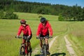 Summer - Young sportive couple riding bike