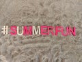 #summerfun summer fun written on the sand at the beach Royalty Free Stock Photo