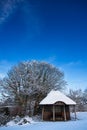 Summerhouse building in winter under blue sky Royalty Free Stock Photo