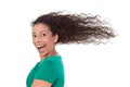 Summertime: Crazy woman in green with blowing hair in wind isolated. Royalty Free Stock Photo