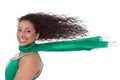 Summertime: Crazy woman in green with blowing hair in wind isolated. Royalty Free Stock Photo