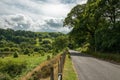 Summertime forests and mountain scenery along a country road in the Elan valley of Wales. Royalty Free Stock Photo