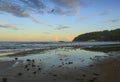 Summertime.Gargano coast:Portonuovo beach Vieste: waves breaking on sandy shoreline after sunset. Apulia,ITALY. Royalty Free Stock Photo