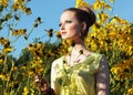Summertime. Girl in Meadow among Yellow Flowers Royalty Free Stock Photo