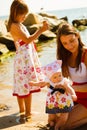 Woman playing with children on beach Royalty Free Stock Photo