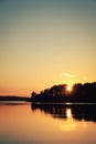 Summertime. Peaceful sunset at Kenozero lake.