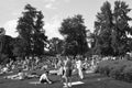 Summertime: people in ZÃÂ¼rich Seefeld lake promenade and park are taking a sun bath