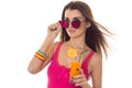 Summertime portrait of young charming girl in light clothes and sunglasses with cocktail in hands posing isolated on Royalty Free Stock Photo