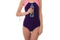 Summertime portrait of young sexual lady in full length swimsuit with bottle water and measure tape isolated on whit Royalty Free Stock Photo