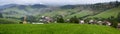 Summertime rural landscape banner, panorama - view at christian cross and the village Pucov, Slovakia