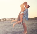 Summertime smooches. an affectionate young couple at the beach. Royalty Free Stock Photo