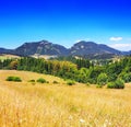 Summertime view of meadow with Chocsky hills, Pravnac and Lomy