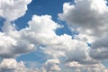 Summery background of blue sky with white clouds