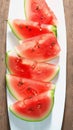 Summery refreshment Watermelon slice on white plate background, close up Royalty Free Stock Photo