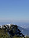 Summit cross of Breitenstein mountain, Bavaria, Germany, in wintertime Royalty Free Stock Photo
