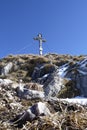 Summit cross of Breitenstein mountain, Bavaria, Germany, in wintertime Royalty Free Stock Photo