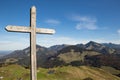 Summit Cross in Front of Panorama of European Alps