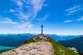 The summit cross from the Heimgarten with the Walchensee in the background