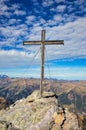 Summit cross on the Hochwart mountain in the Pizol area above the Wildsee and Batoni. Hiking in beautiful autumn.