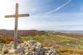 Summit cross on a rocky mountain peak overlooking beautiful autumn landscape in the Swabian Jura Royalty Free Stock Photo